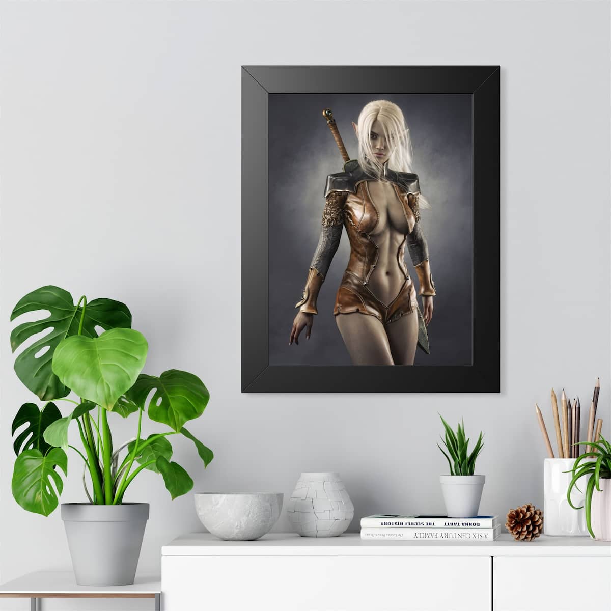 Modern minimalist room featuring a framed fantasy art print of a dark elf warrior with long white hair, pointed ears, leather armor, and a sword. This epic fantasy wall décor adds a striking medieval focal point to contemporary interiors.