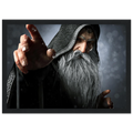 A framed art print depicting an elderly wizard with a long white beard and hood, pointing forward against a dark, atmospheric background.