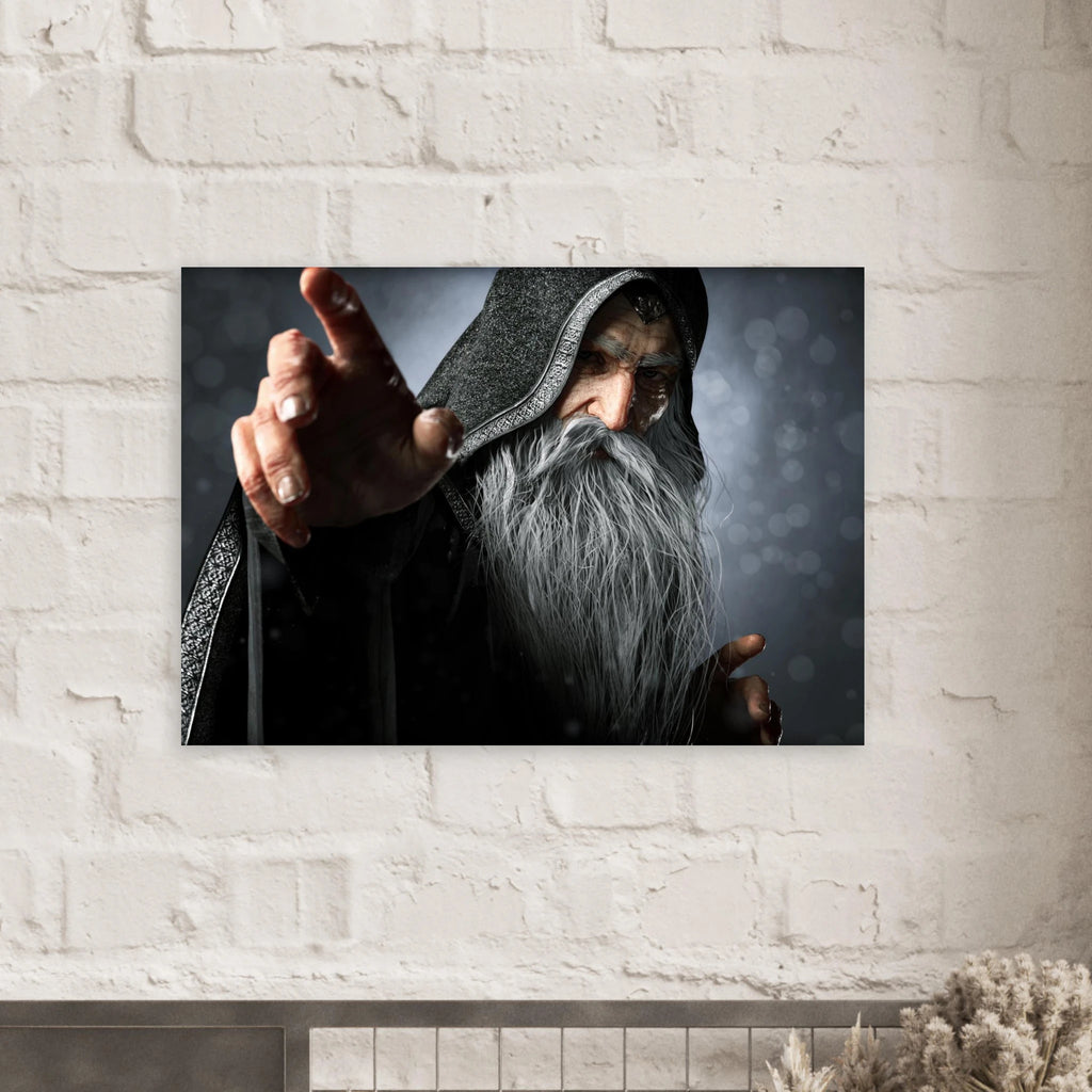 A rectangular wall art print showing a hooded wizard with a long gray beard pointing forward, mounted on a white brick wall above a mantel.
